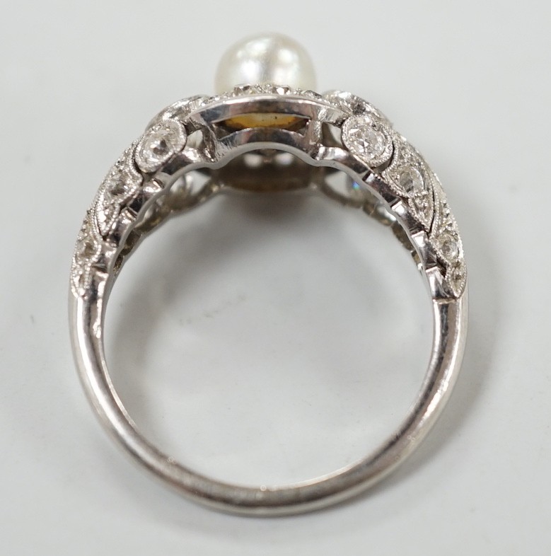 A white metal(stamped Platin), cultured pearl and diamond set circular cluster ring, size M, gross weight 5 grams.